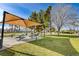 Community BBQ area with shaded seating and picnic tables at 3318 N Decatur Blvd # 2047, Las Vegas, NV 89130