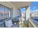 Relaxing balcony with patio furniture, offering views of the community at 3318 N Decatur Blvd # 2047, Las Vegas, NV 89130