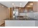 Modern kitchen features stainless steel appliances and granite countertops at 353 E Bonneville Ave # 103, Las Vegas, NV 89101