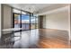 Spacious living area with hardwood floors and floor to ceiling windows at 353 E Bonneville Ave # 103, Las Vegas, NV 89101