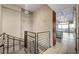 Metal spiral staircase with chandelier overhead and tiled floor at 353 E Bonneville Ave # 103, Las Vegas, NV 89101