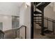 Metal spiral staircase connecting floors in contemporary loft at 353 E Bonneville Ave # 103, Las Vegas, NV 89101