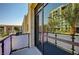 Private balcony with glass railings and city views at 353 E Bonneville Ave # 181/281, Las Vegas, NV 89101