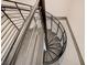 Modern spiral staircase with metal railings at 353 E Bonneville Ave # 181/281, Las Vegas, NV 89101