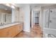 Double vanity bathroom with granite countertop and shower at 353 E Bonneville Ave # 503, Las Vegas, NV 89101