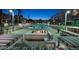 Stunning nighttime view of resort-style pool and fire pit at 353 E Bonneville Ave # 503, Las Vegas, NV 89101