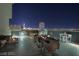 Private rooftop terrace with city views and dining furniture at 353 E Bonneville Ave # 503, Las Vegas, NV 89101