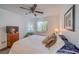 Bright bedroom with a queen bed and ceiling fan at 3760 Desert Marina Dr # 67, Laughlin, NV 89029