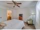 Comfortable bedroom with a queen bed, ceiling fan, and a view of the bathroom at 3760 Desert Marina Dr # 67, Laughlin, NV 89029