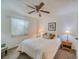 Comfortable bedroom with a queen-size bed and ceiling fan at 3760 Desert Marina Dr # 67, Laughlin, NV 89029