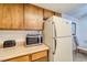 Bright kitchen features wood cabinets, microwave, and refrigerator at 3760 Desert Marina Dr # 67, Laughlin, NV 89029