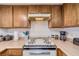 Kitchen with stove, cabinets, and countertop appliances at 3760 Desert Marina Dr # 67, Laughlin, NV 89029