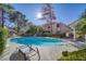 Inviting community pool with surrounding lounge chairs at 3760 Desert Marina Dr # 67, Laughlin, NV 89029