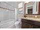 Bathroom with tub, toilet and granite countertop at 39 Cranberry Cove Ct, Las Vegas, NV 89135