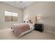 Bright bedroom with a queen-size bed and neutral decor at 39 Cranberry Cove Ct, Las Vegas, NV 89135