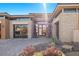 Modern home exterior with stone accents and a glass entryway at 39 Cranberry Cove Ct, Las Vegas, NV 89135