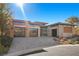 Stunning contemporary home with a three-car garage and landscaped front yard at 39 Cranberry Cove Ct, Las Vegas, NV 89135