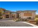 Single-story home with modern design, neutral color palette, and landscaped front yard at 39 Cranberry Cove Ct, Las Vegas, NV 89135