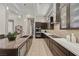 Modern kitchen featuring granite countertops and dark wood cabinetry at 39 Cranberry Cove Ct, Las Vegas, NV 89135