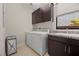 Bright laundry room with washer, dryer, and ample cabinetry at 39 Cranberry Cove Ct, Las Vegas, NV 89135