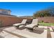 Patio with lounge chairs and a view of the backyard at 39 Cranberry Cove Ct, Las Vegas, NV 89135