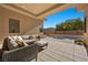 Covered patio with wicker furniture and view of pool at 39 Cranberry Cove Ct, Las Vegas, NV 89135