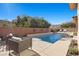 Spacious pool with seating area and brick wall at 39 Cranberry Cove Ct, Las Vegas, NV 89135