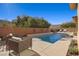 Resort style pool with comfortable seating and landscaping at 39 Cranberry Cove Ct, Las Vegas, NV 89135