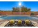 Inviting pool with a brick wall and desert landscaping at 39 Cranberry Cove Ct, Las Vegas, NV 89135