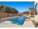 Modern pool and patio with tan colored deck at 39 Cranberry Cove Ct, Las Vegas, NV 89135