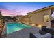 Relaxing pool and patio furniture at dusk at 39 Cranberry Cove Ct, Las Vegas, NV 89135