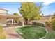 Landscaped backyard with brick path and pergola at 4120 Scotmist Ct, Las Vegas, NV 89129