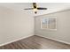 Bedroom with wood-look floors and window with blinds at 4120 Scotmist Ct, Las Vegas, NV 89129