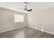 Bedroom with wood-look floors and ceiling fan at 4120 Scotmist Ct, Las Vegas, NV 89129