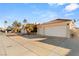 House exterior showcasing a two-car garage and driveway at 4120 Scotmist Ct, Las Vegas, NV 89129