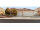 Single-story house with a two-car garage and landscaped front yard at 4120 Scotmist Ct, Las Vegas, NV 89129