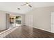 Living room with hardwood floors, sliding glass doors, and access to backyard at 4120 Scotmist Ct, Las Vegas, NV 89129