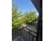 View from a balcony overlooking a courtyard with trees at 4186 Silver Dollar Ave # 8, Las Vegas, NV 89102