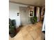 Apartment entry with tiled floor and potted plants at 4186 Silver Dollar Ave # 8, Las Vegas, NV 89102