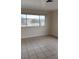 Spacious bedroom featuring tile floors, natural light, and a view outside the window at 441 N 13Th St, Las Vegas, NV 89101