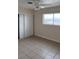 Bright bedroom with tile floors, closet, and a large window with neighborhood views at 441 N 13Th St, Las Vegas, NV 89101