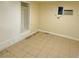 Bedroom featuring tile flooring, neutral paint, closet with drawers, and an air conditioning unit at 447 N 13Th St, Las Vegas, NV 89101