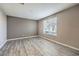 Bedroom with neutral walls and wood-look flooring at 4516 Townwall St, Las Vegas, NV 89115