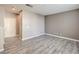 Spacious living room with gray walls and wood-look flooring at 4516 Townwall St, Las Vegas, NV 89115