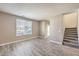 Bright living room with laminate wood floors and neutral walls at 4516 Townwall St, Las Vegas, NV 89115