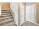 Stairwell with grey carpeting and a coat closet at 4516 Townwall St, Las Vegas, NV 89115