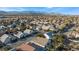 Aerial view of a house in a residential neighborhood with mountain views at 5522 Oakview Falls Ct, Las Vegas, NV 89148