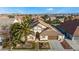 Aerial view of house with front yard landscaping and a fountain at 5522 Oakview Falls Ct, Las Vegas, NV 89148