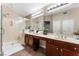 Spa-like bathroom with double sinks and a large shower at 5522 Oakview Falls Ct, Las Vegas, NV 89148