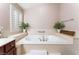 Relaxing bathroom with a large soaking tub and updated fixtures at 5522 Oakview Falls Ct, Las Vegas, NV 89148